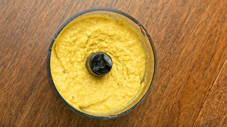 Homemade hummus in food processor