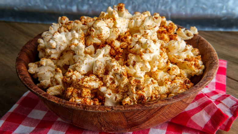 Wooden bowl of seasoned popcorn