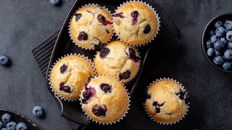 Blueberry muffins on black tray