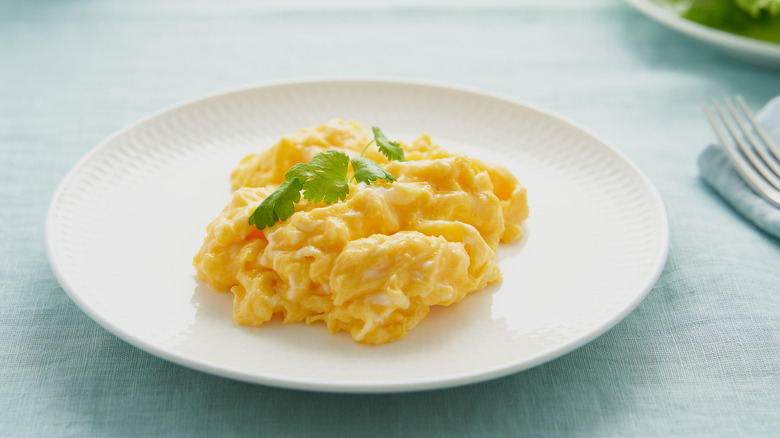 plate of scrambled eggs with garnish