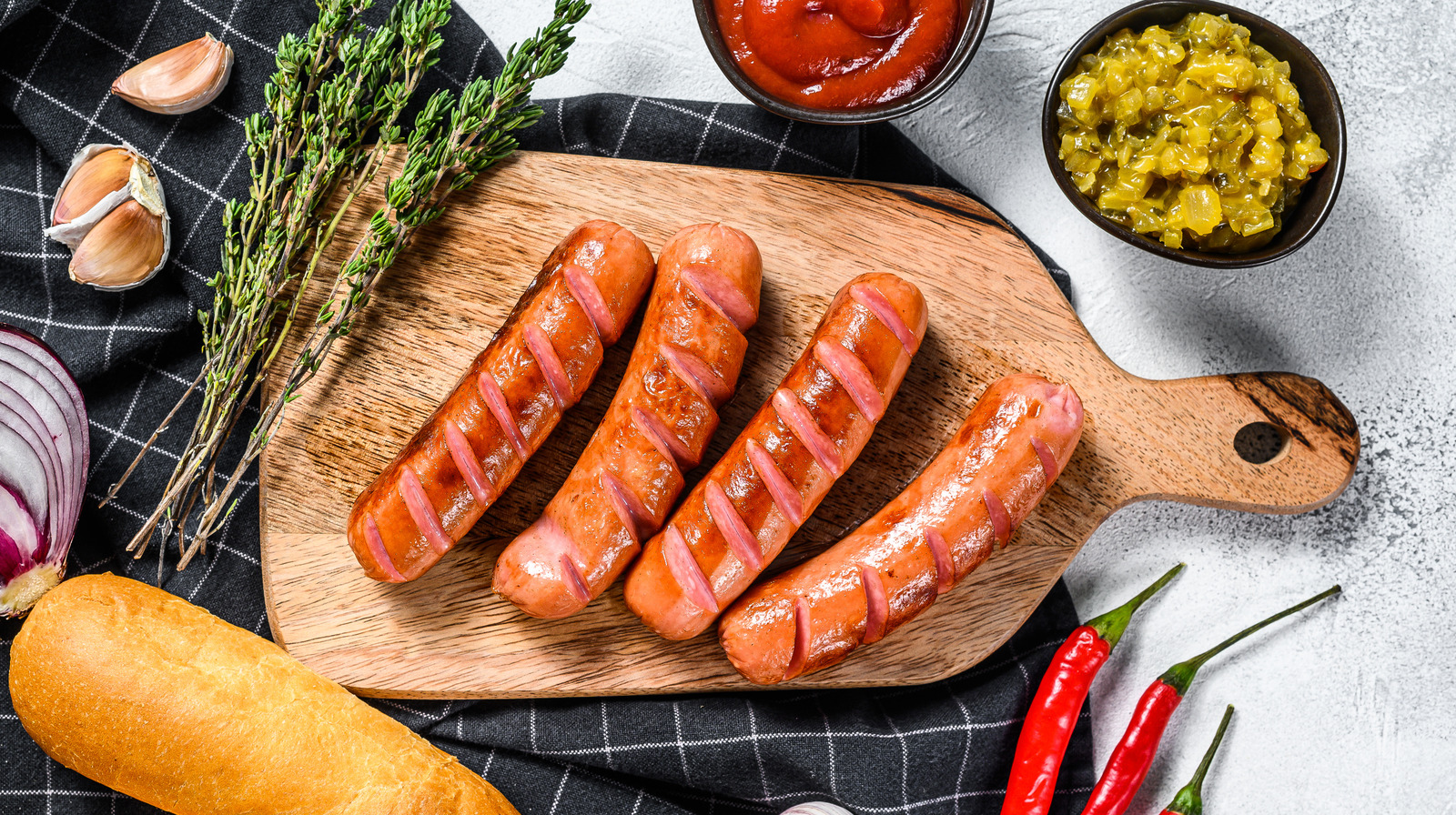 https://www.thedailymeal.com/img/gallery/14-ways-you-never-thought-to-use-hot-dogs/l-intro-1676577465.jpg