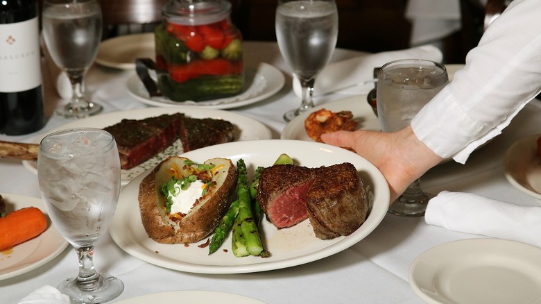 Steak and potato on plate