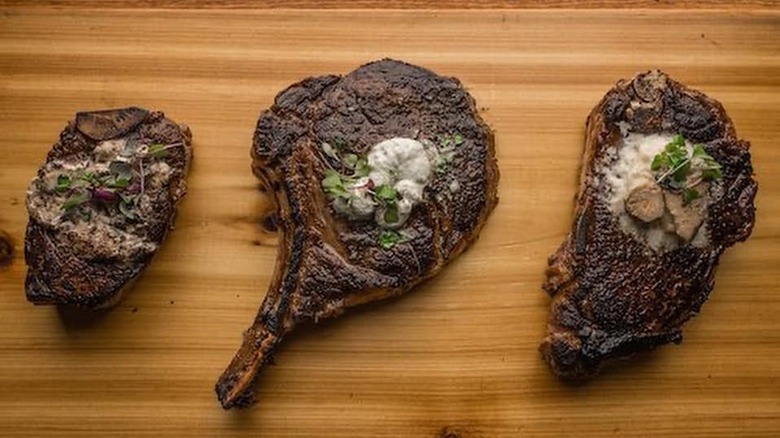 Different steaks on a board