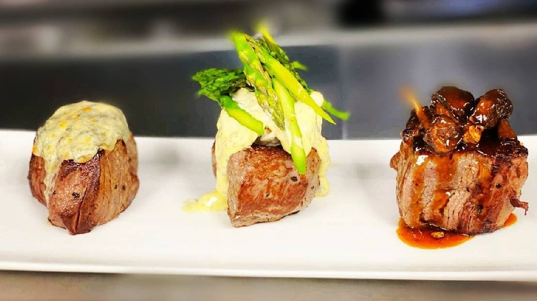 selection of steaks on plate