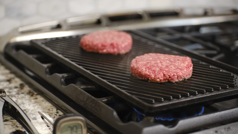 burgers patties on a griddle