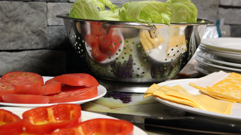 burger toppings on plates