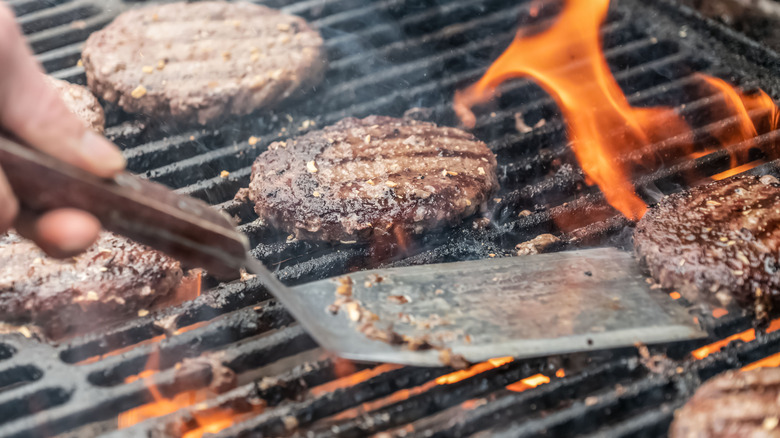 closeup of burger patties cooking