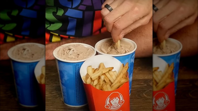 Dipping fries in milkshake