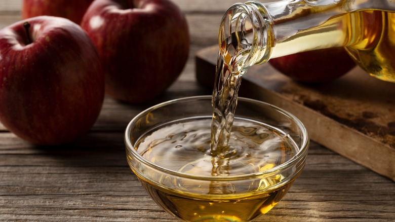 pouring vinegar in bowl