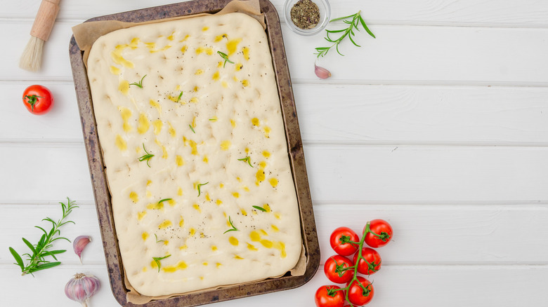 Olive oil brine on focaccia dough