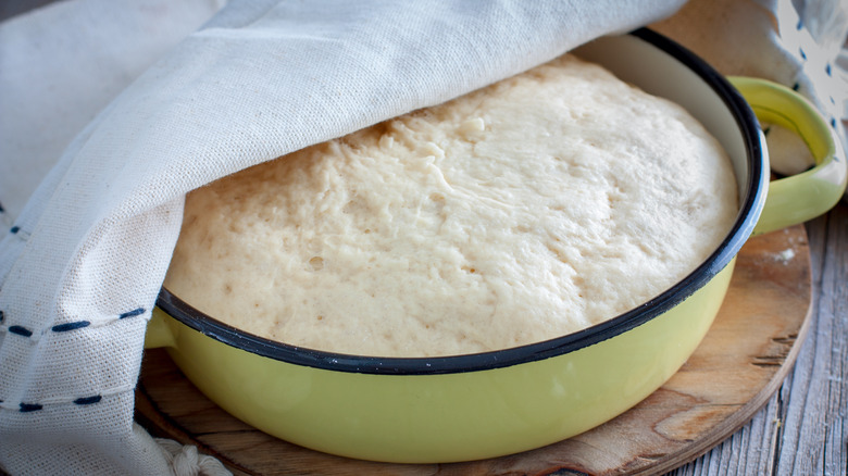 Rising dough in green bowl