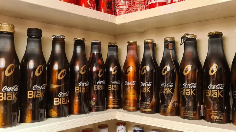 shelf of Coca-Cola Blak bottles