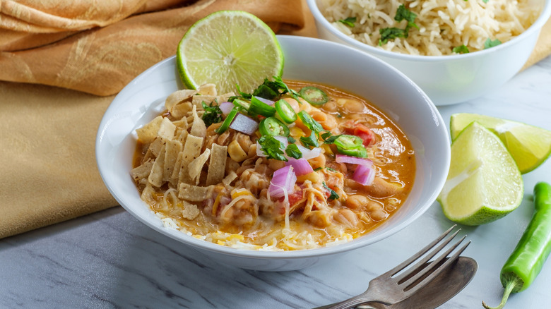 shredded chicken chili lime wedges and rice