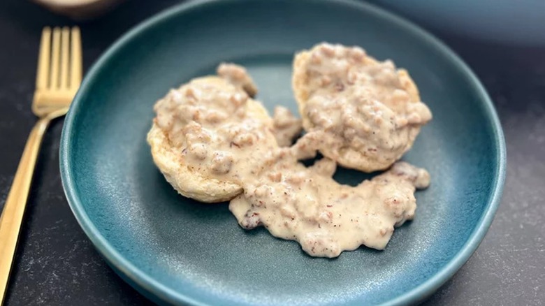 Biscuits and gravy on a blue plate