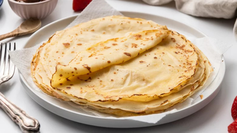 A stack of crepes on a plate