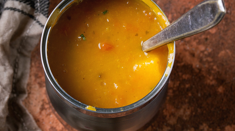 canned soup with spoon