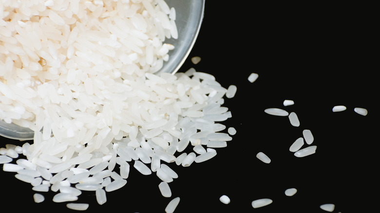 White rice on black background