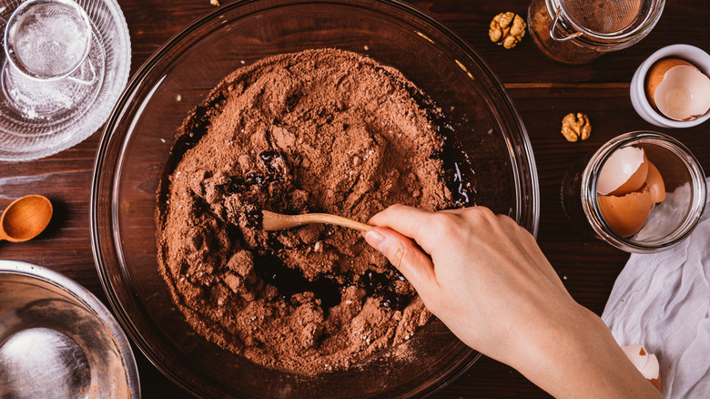 Person mixing dough in bowl