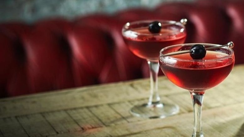 Two Martinez cocktails with olives