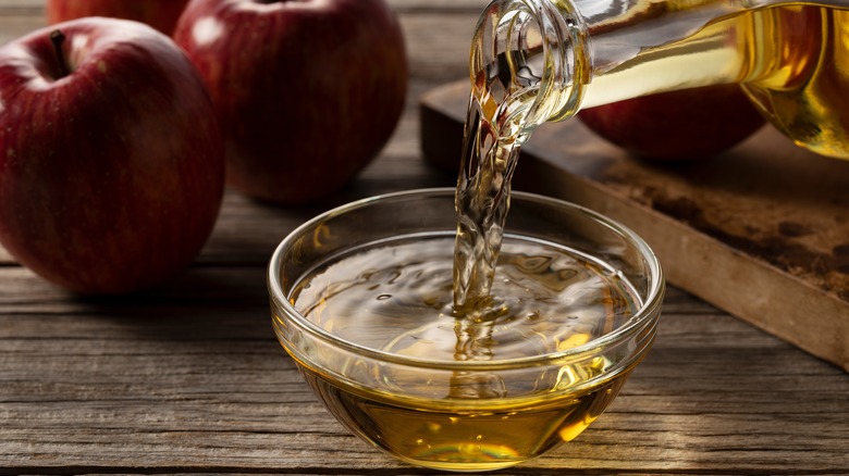 Pouring vinegar into bowl