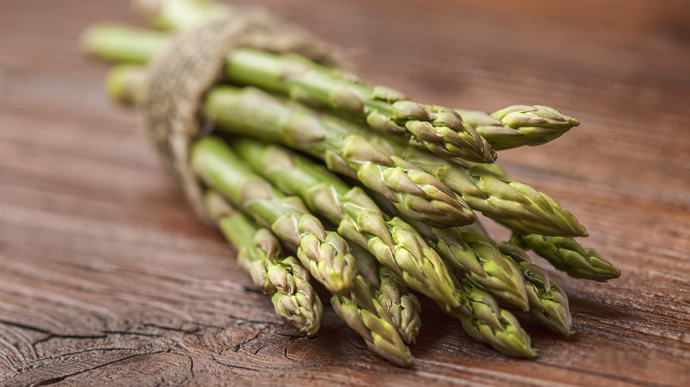 Fresh asparagus on wooden counter