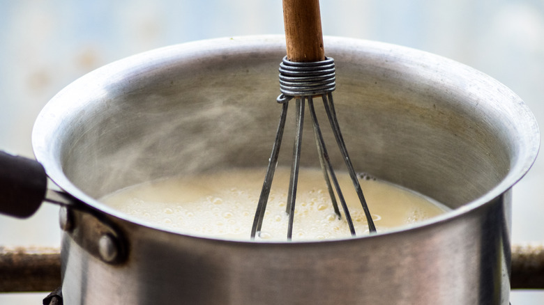 Whisking hot milk