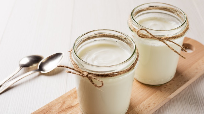 Jars with yogurt on board