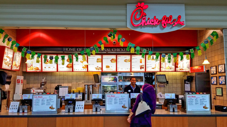 Woman ordering at Chick-fil-a