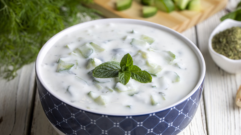 Decorative blue and white bowl filled with tzatziki