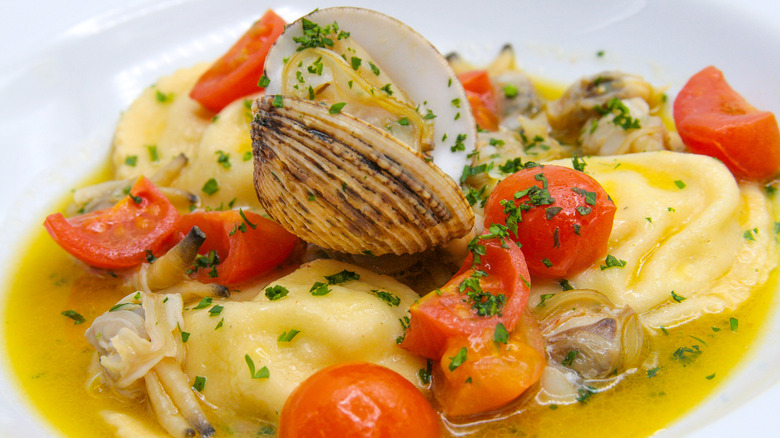 Ravioli with clams and tomatoes