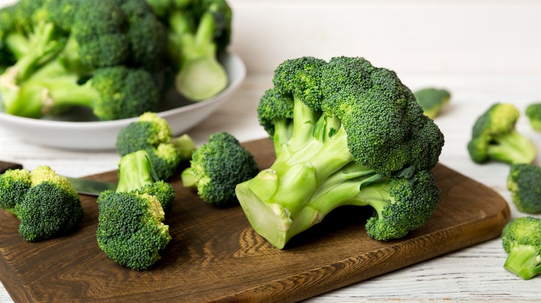 broccoli pieces on a board