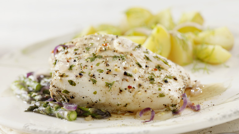 cooked halibut fillet on plate