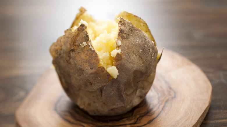 baked potato on wooden board