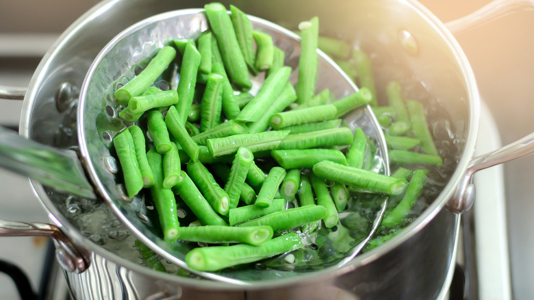 Straining boiled green beans