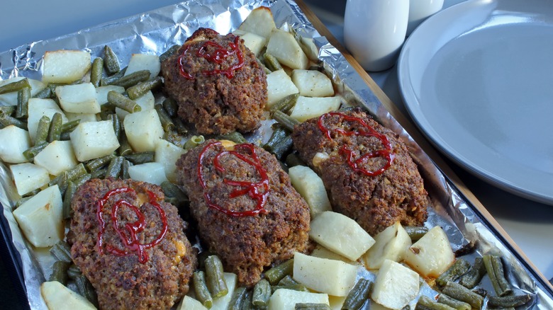 Individual meatloaf on baking sheet