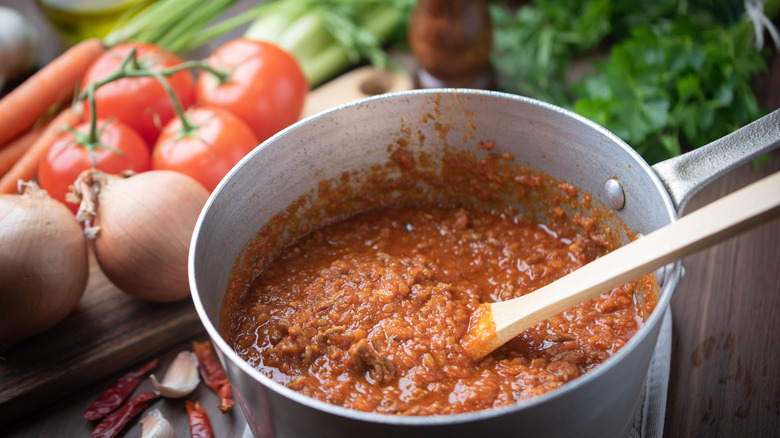 pot of ragu with spoon