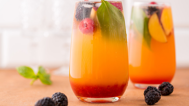 Peach blackberry cocktail with basil