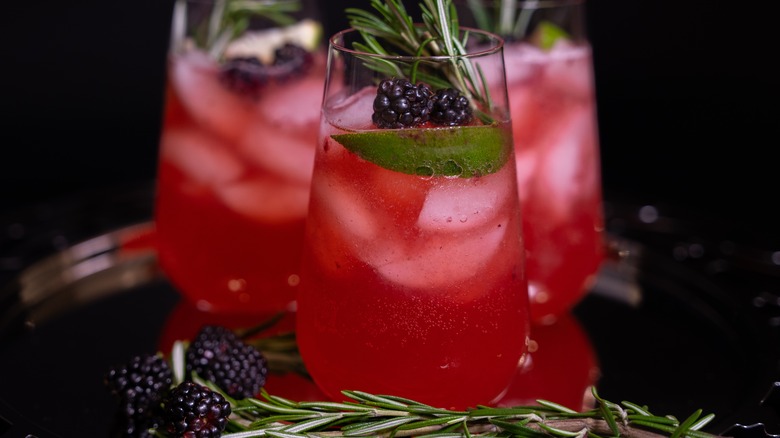 Blackberry cocktails with rosemary sprigs