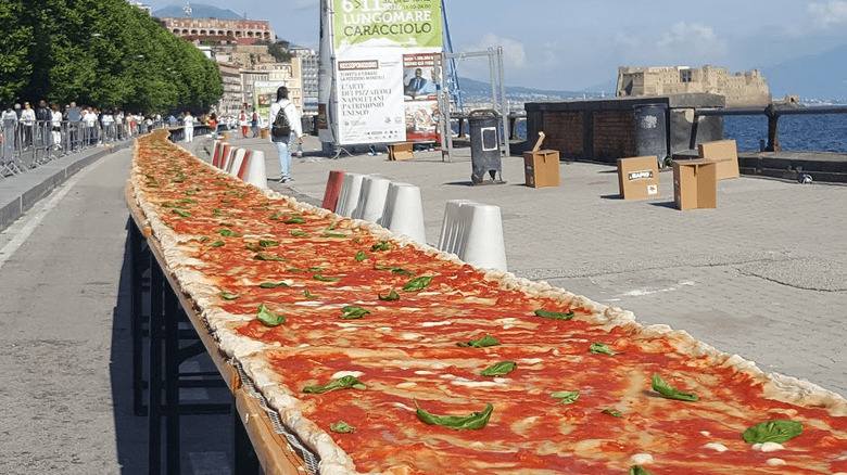 Huge communal pizza on table 