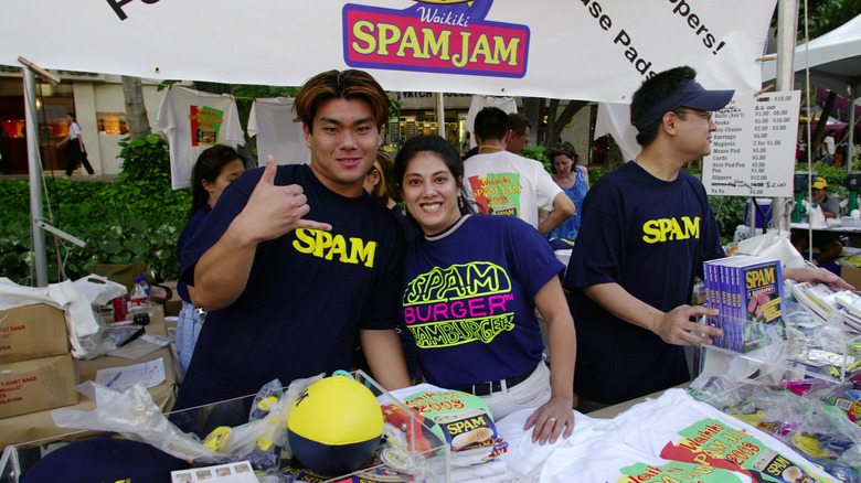 booth operators with Spam merchandise