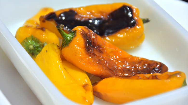 charred banana peppers in bowl