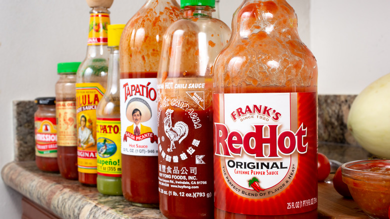 variety of hot sauces on shelf