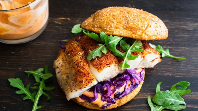 fish, cabbage, and arugula sandwich