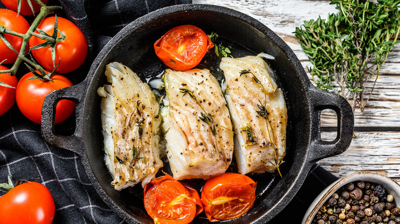 white fish in cast iron pan