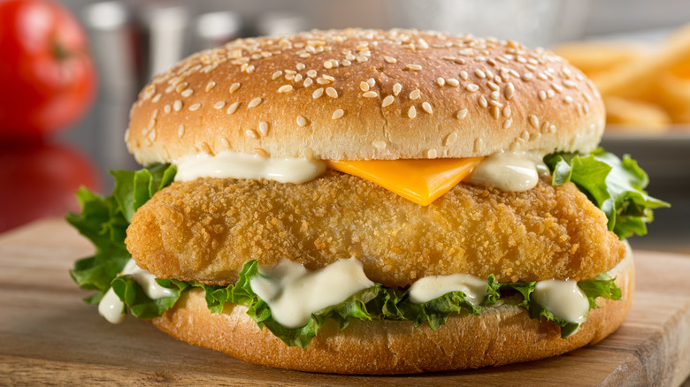 fish sandwich on wooden board