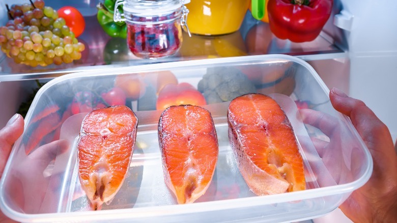 salmon in plastic container