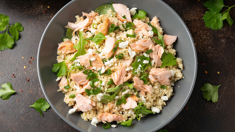 Salmon over quinoa in gray bowl