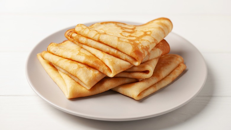 Crepes on white plate