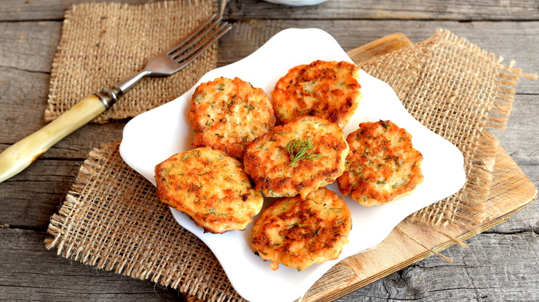 Salmon patties on white plate