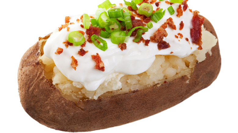 Baked potato with bacon and sour cream